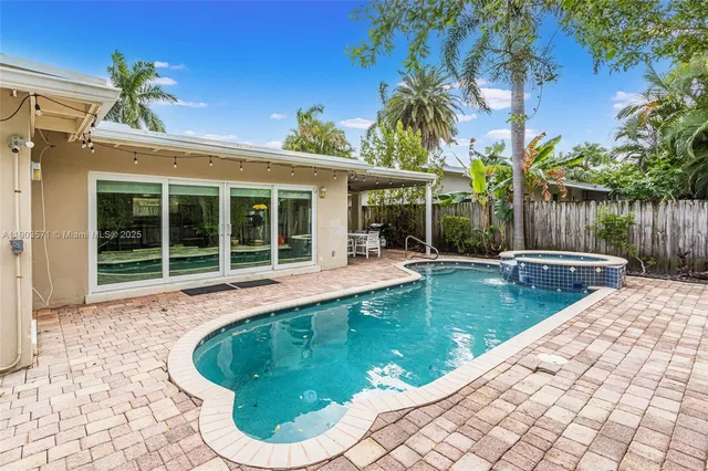 a view of a swimming pool with a patio
