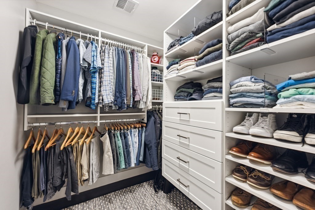 40 Carver Road Wellesley, MA 02481 - Photo 15 of 34 a view of walk in closet with clothes and shoes