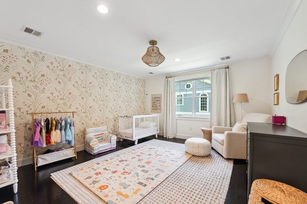 40 Carver Road Wellesley, MA 02481 - Photo 20 of 34 a bedroom with furniture and a book shelf