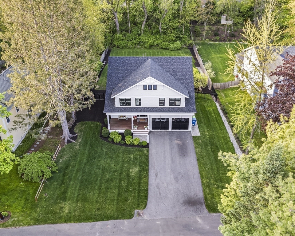 40 Carver Road Wellesley, MA 02481 - Photo 25 of 34 a view of a house with a small yard plants and large trees