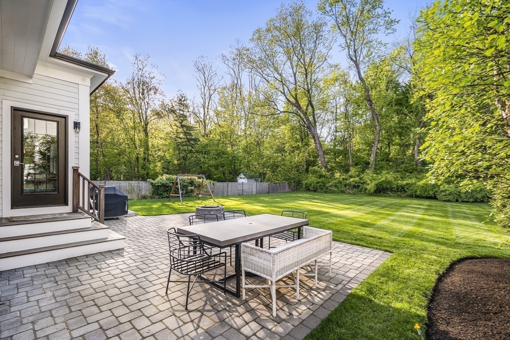 40 Carver Road Wellesley, MA 02481 - Photo 29 of 34 a view of a backyard with swimming pool and sitting area