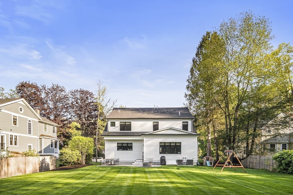 40 Carver Road Wellesley, MA 02481 - Photo 30 of 34 a front view of a house with a garden