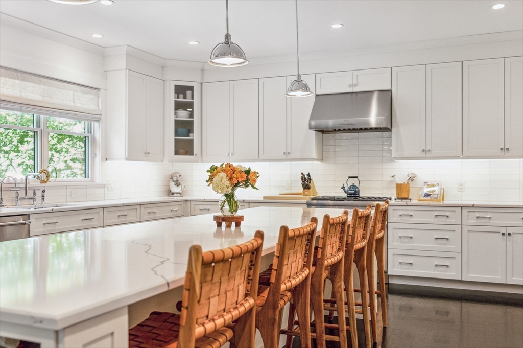 40 Carver Road Wellesley, MA 02481 - Photo 4 of 34 a kitchen with stainless steel appliances granite countertop a sink a stove and a wooden floors