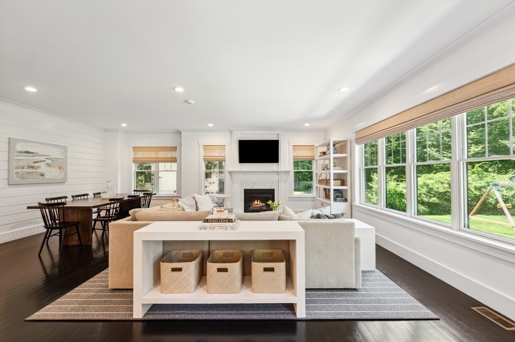 40 Carver Road Wellesley, MA 02481 - Photo 8 of 34 a living room with stainless steel appliances furniture a fireplace and a open kitchen view