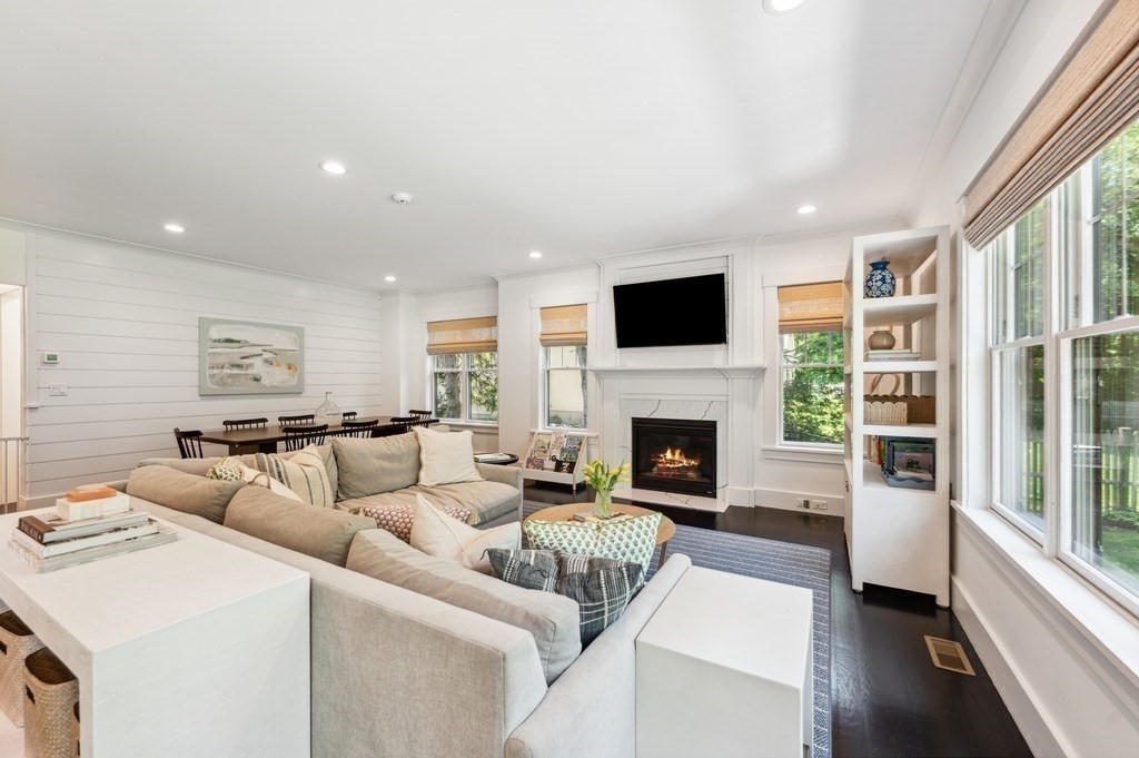 40 Carver Road Wellesley, MA 02481 - Photo 9 of 34 a living room with furniture a fireplace and a flat screen tv