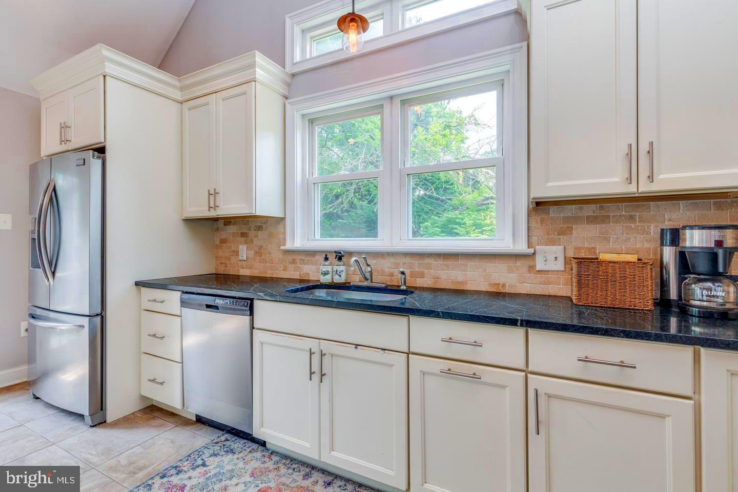 284 Bewley Road Haddonfield, NJ 08033 - Photo 14 of 36 a kitchen with granite countertop white cabinets white stainless steel appliances a sink and a window