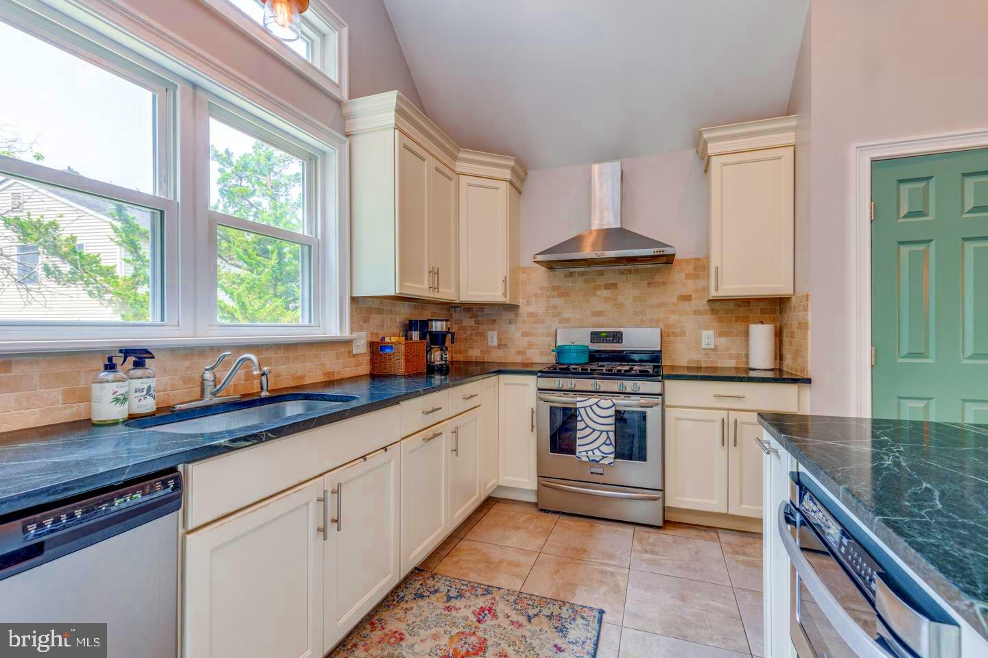 284 Bewley Road Haddonfield, NJ 08033 - Photo 15 of 36 a kitchen with stainless steel appliances granite countertop a stove sink and cabinets