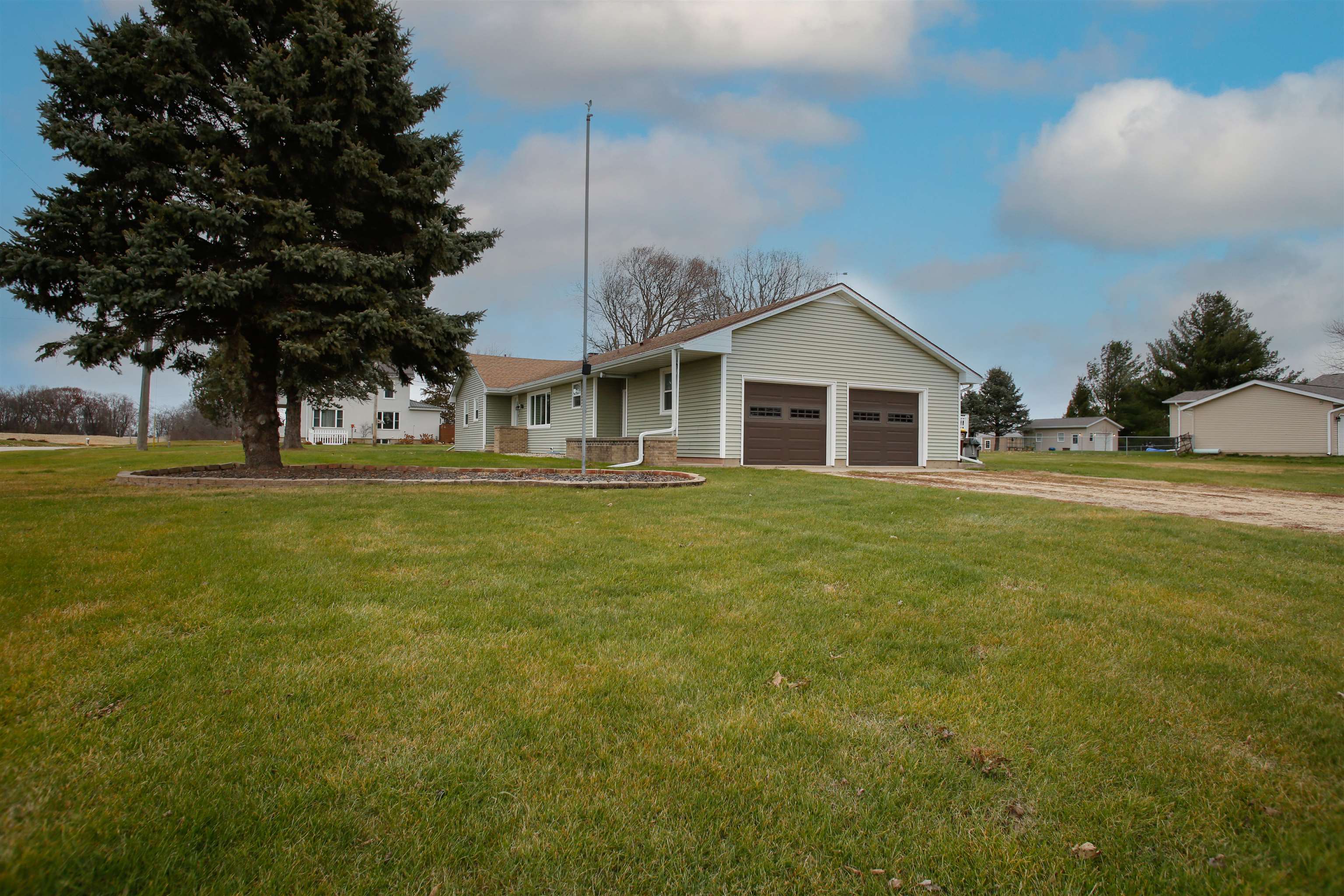 1477 Highway 75 Freeport, IL 61032 - Photo 11 of 13 a front view of a house with a garden