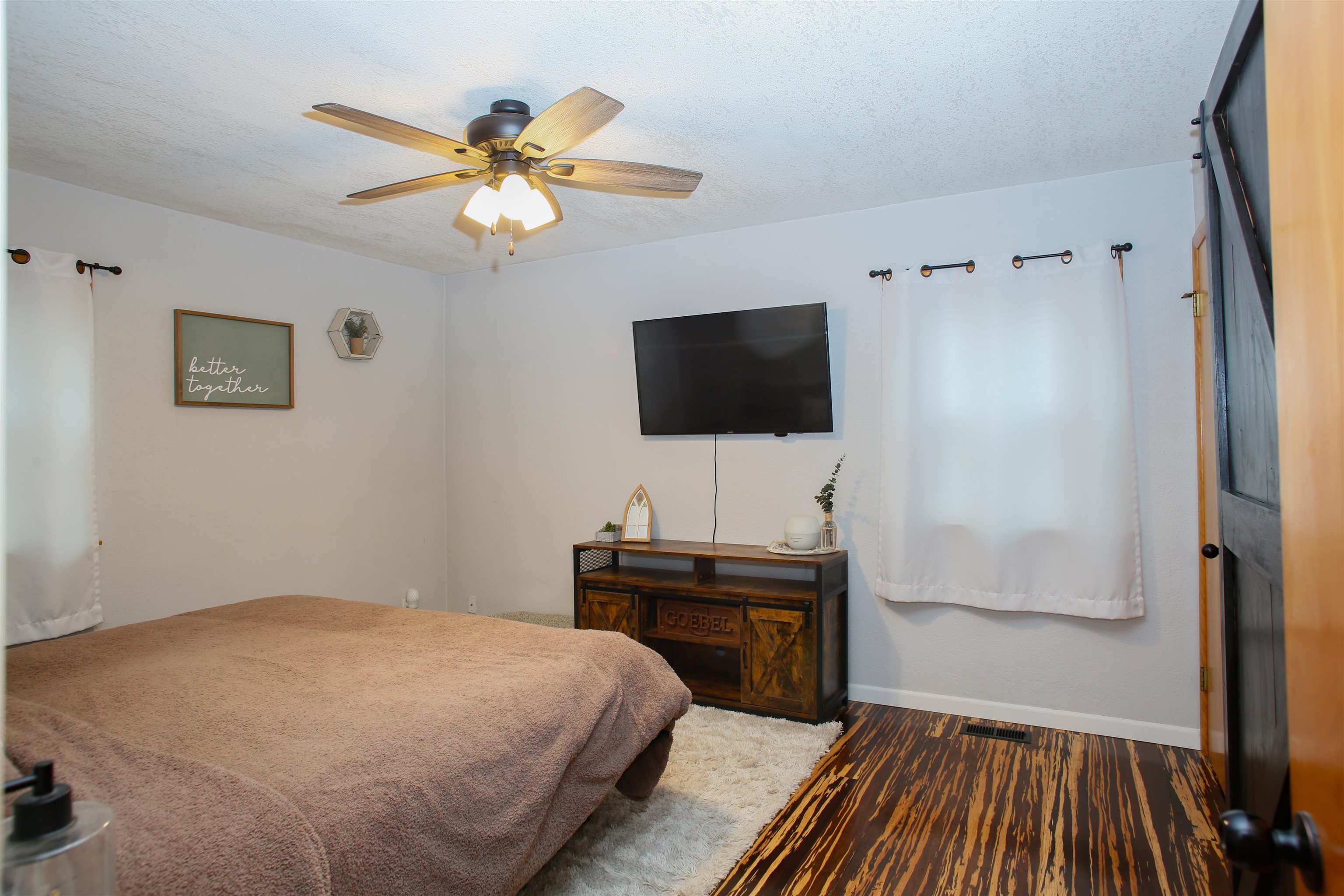 1477 Highway 75 Freeport, IL 61032 - Photo 12 of 13 a bedroom with a bed and a flat screen tv