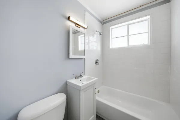 a bathroom with a sink toilet and bathtub