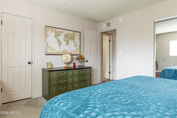 a bedroom with a bed and a window