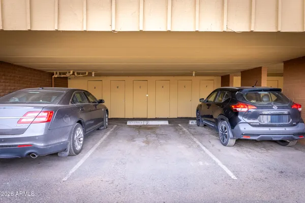 a view of parking garage with cars