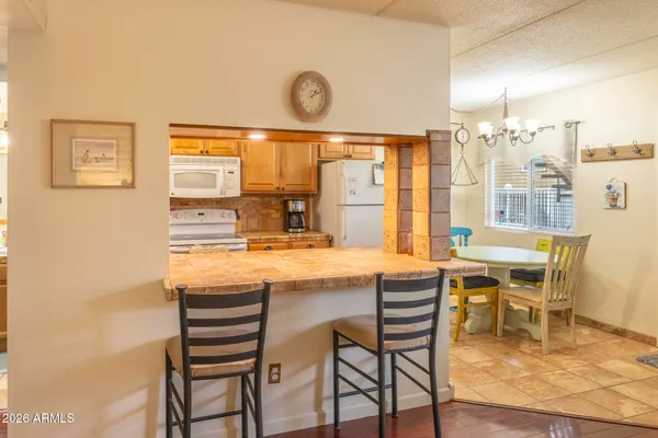 a kitchen with a table and chairs in it