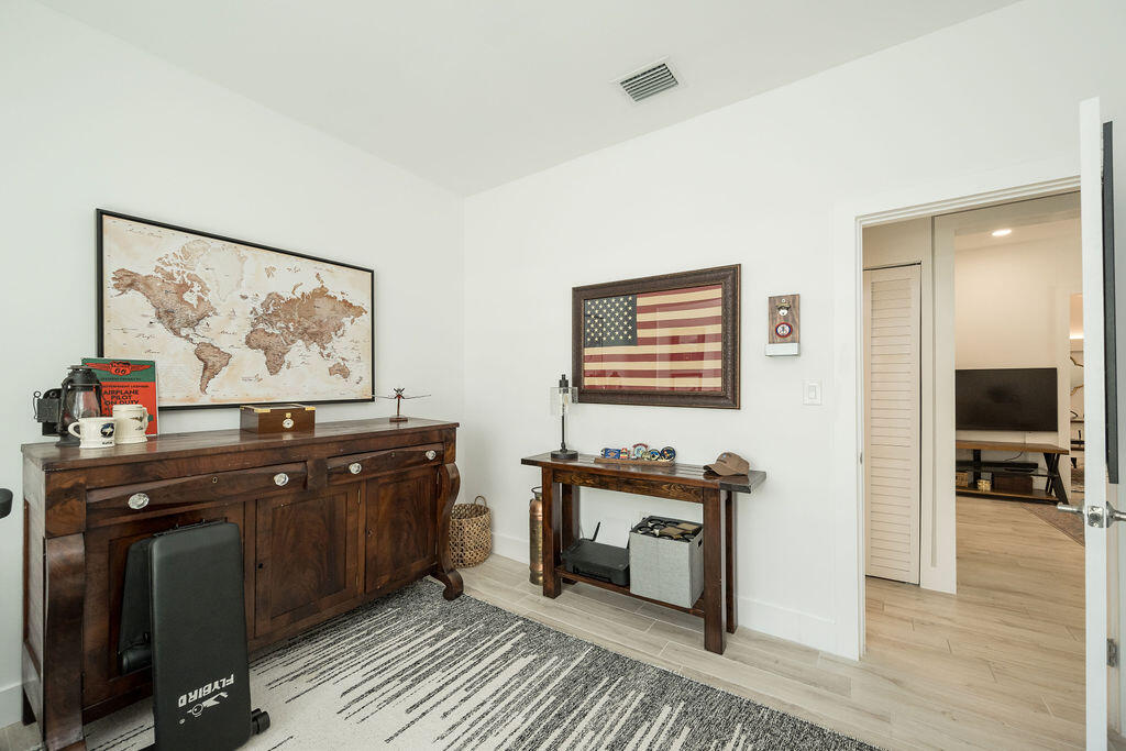 3402 Eagle Avenue Key West, FL 33040 - Photo 12 of 27 a living room with furniture and a flat screen tv