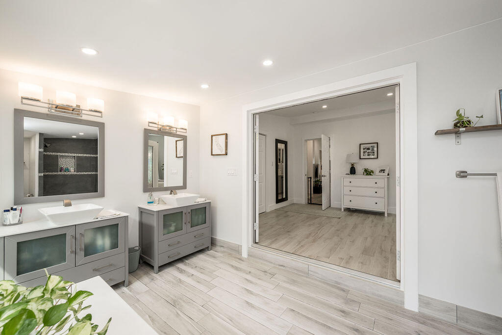 3402 Eagle Avenue Key West, FL 33040 - Photo 18 of 27 a view of a bathroom with a sink and a mirror