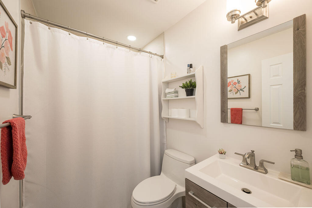 3402 Eagle Avenue Key West, FL 33040 - Photo 24 of 27 a bathroom with a sink mirror and toilet