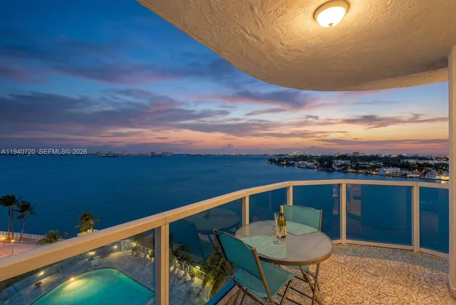 a view of a balcony with chairs
