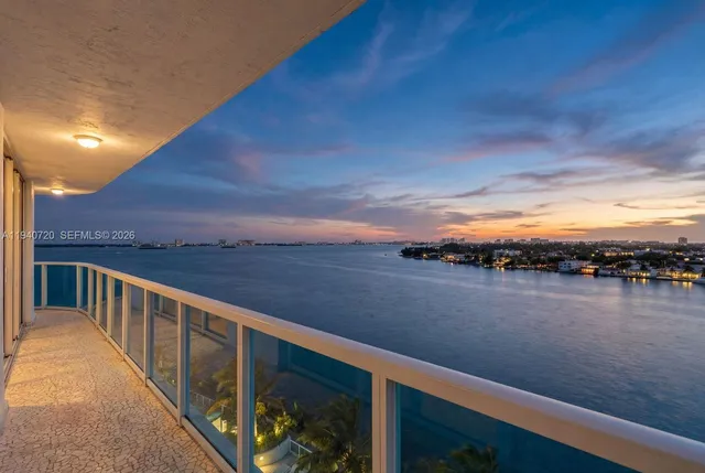 a view of a balcony with lake view and mountain view