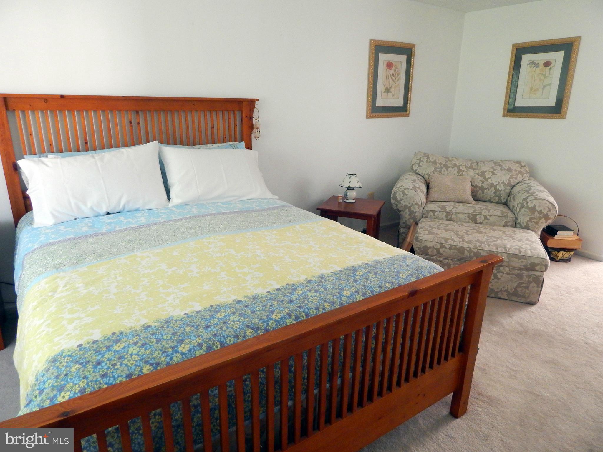 5776 Heming Avenue Springfield, VA 22151 - Photo 15 of 25 a bedroom with bed couch and window