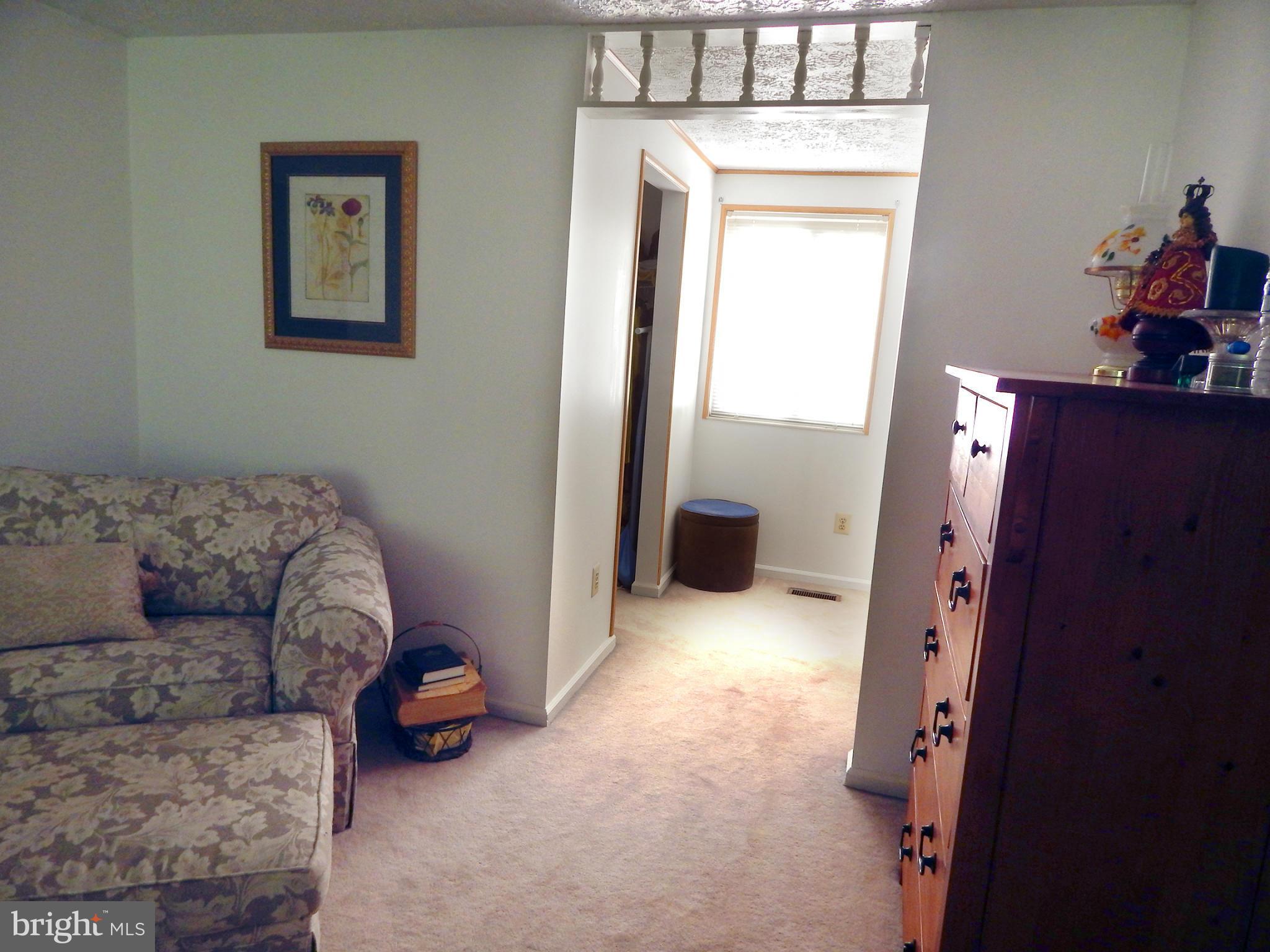 5776 Heming Avenue Springfield, VA 22151 - Photo 16 of 25 a living room with furniture and a window