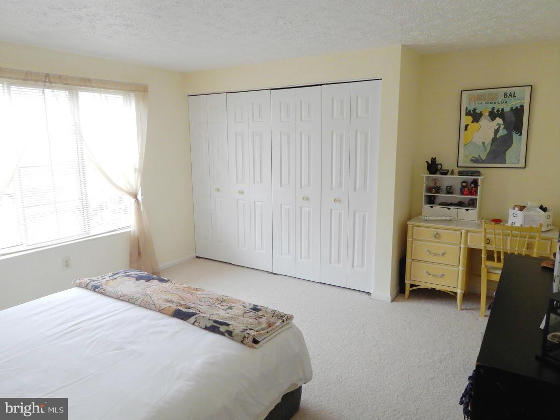 5776 Heming Avenue Springfield, VA 22151 - Photo 22 of 25 a bedroom with a bed and a window