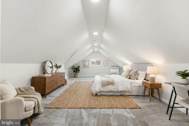 a bedroom with a bed and furniture