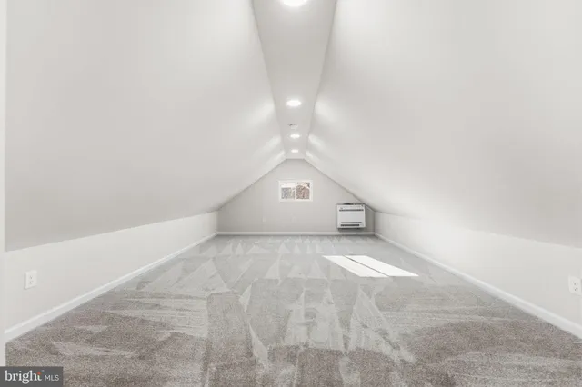 a view of a big room with closet and windows