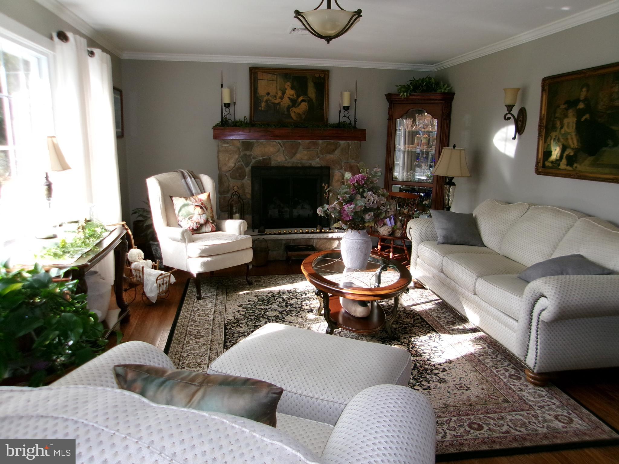22 Nugentown Road Tuckerton, NJ 08087 - Photo 2 of 37 a living room with furniture and a fireplace