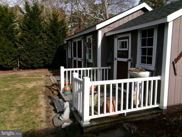 a view of backyard with deck and backyard