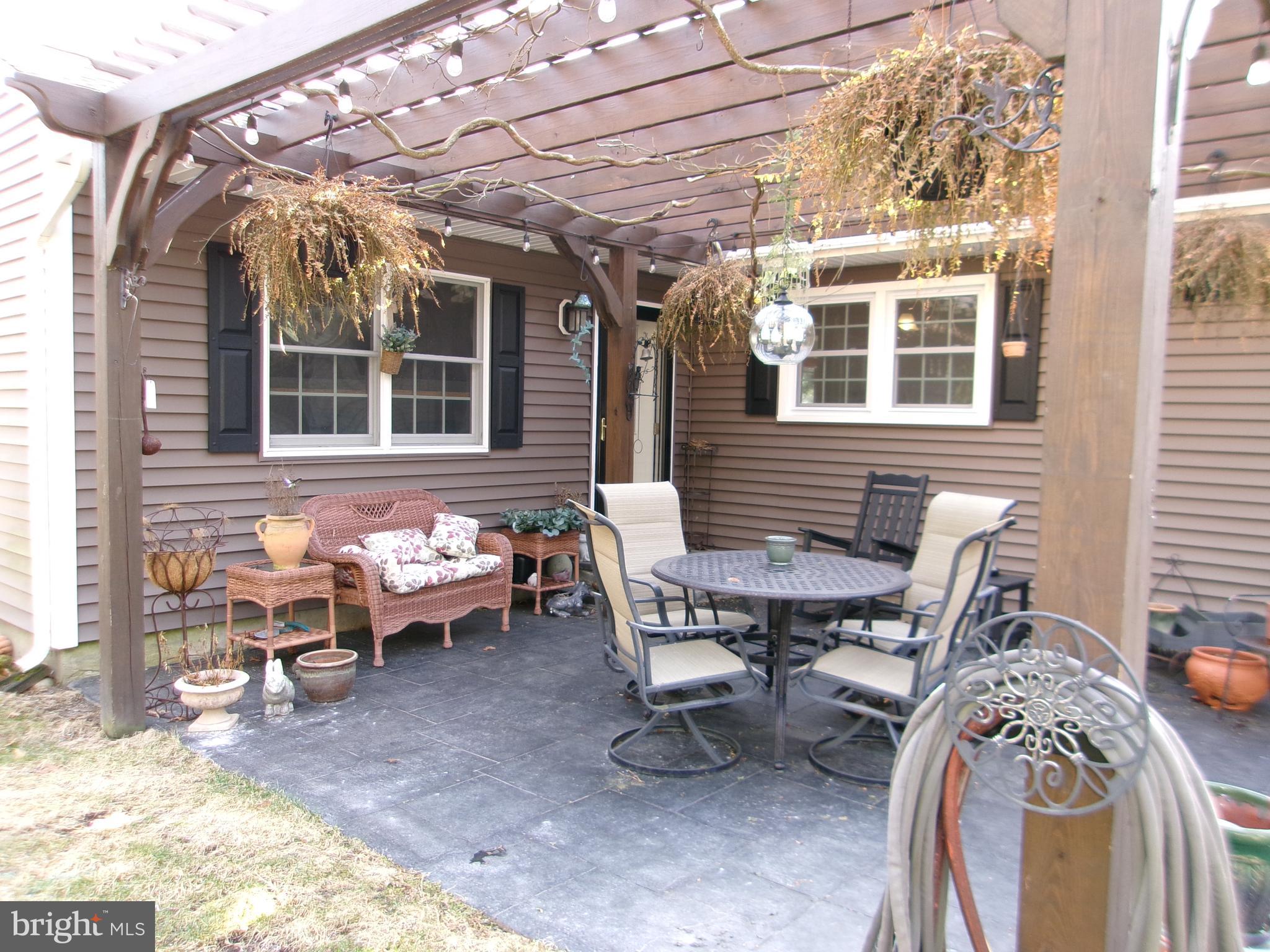 22 Nugentown Road Tuckerton, NJ 08087 - Photo 25 of 37 a view of a chairs and table in a patio