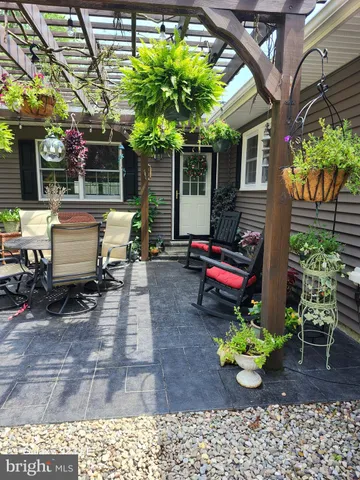 a view of a backyard with sitting area