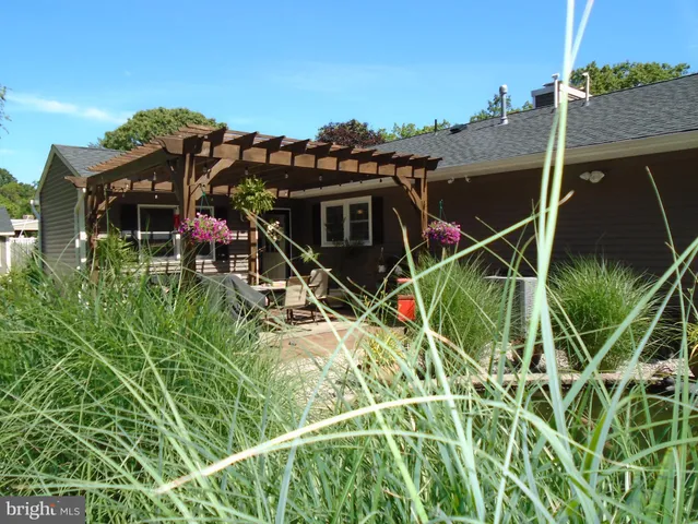 a view of a wooden floor with a table and chairs