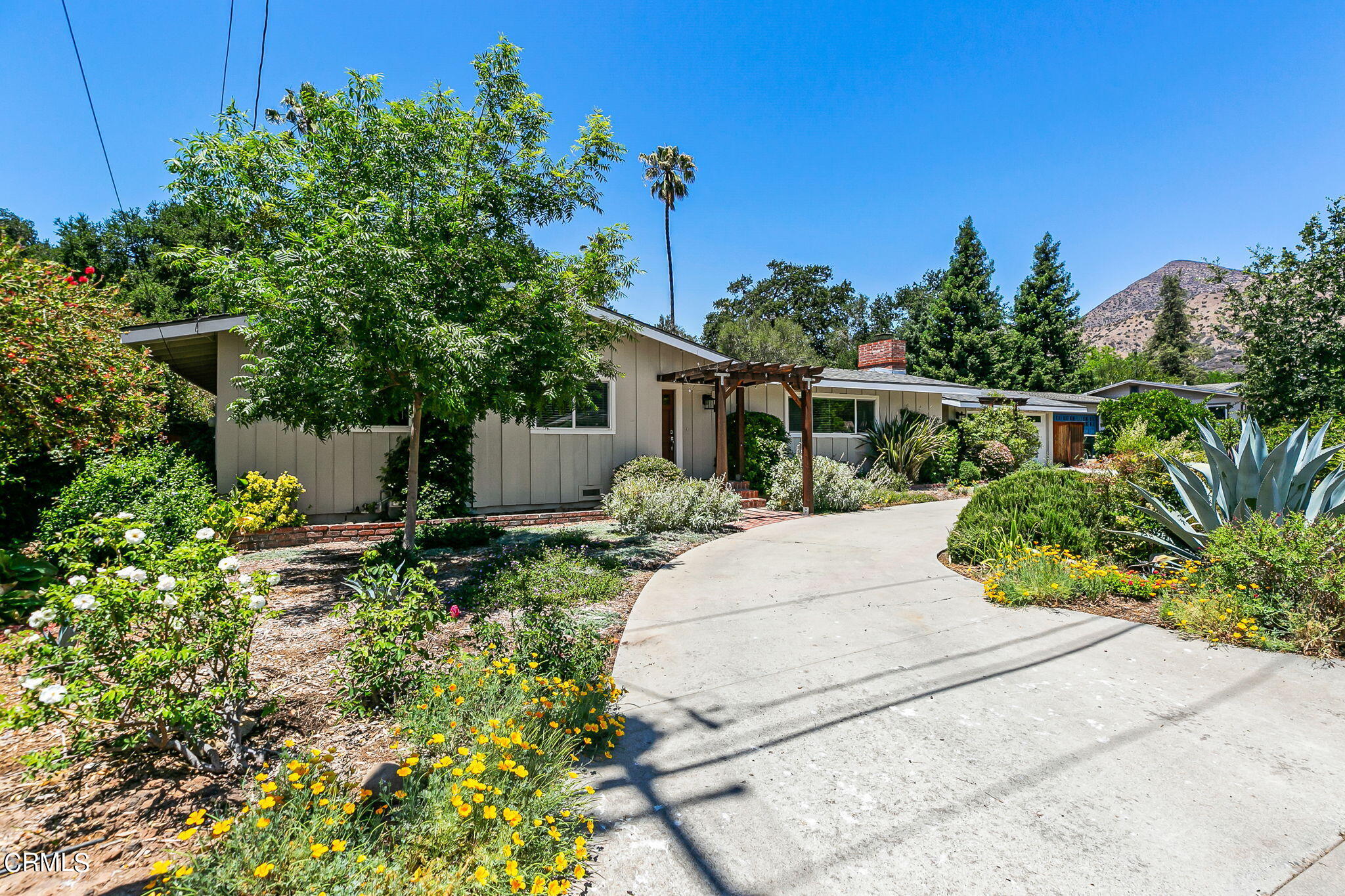 807 Daly Road Ojai, CA 93023 - Photo 2 of 50 a view of a house with a flower garden