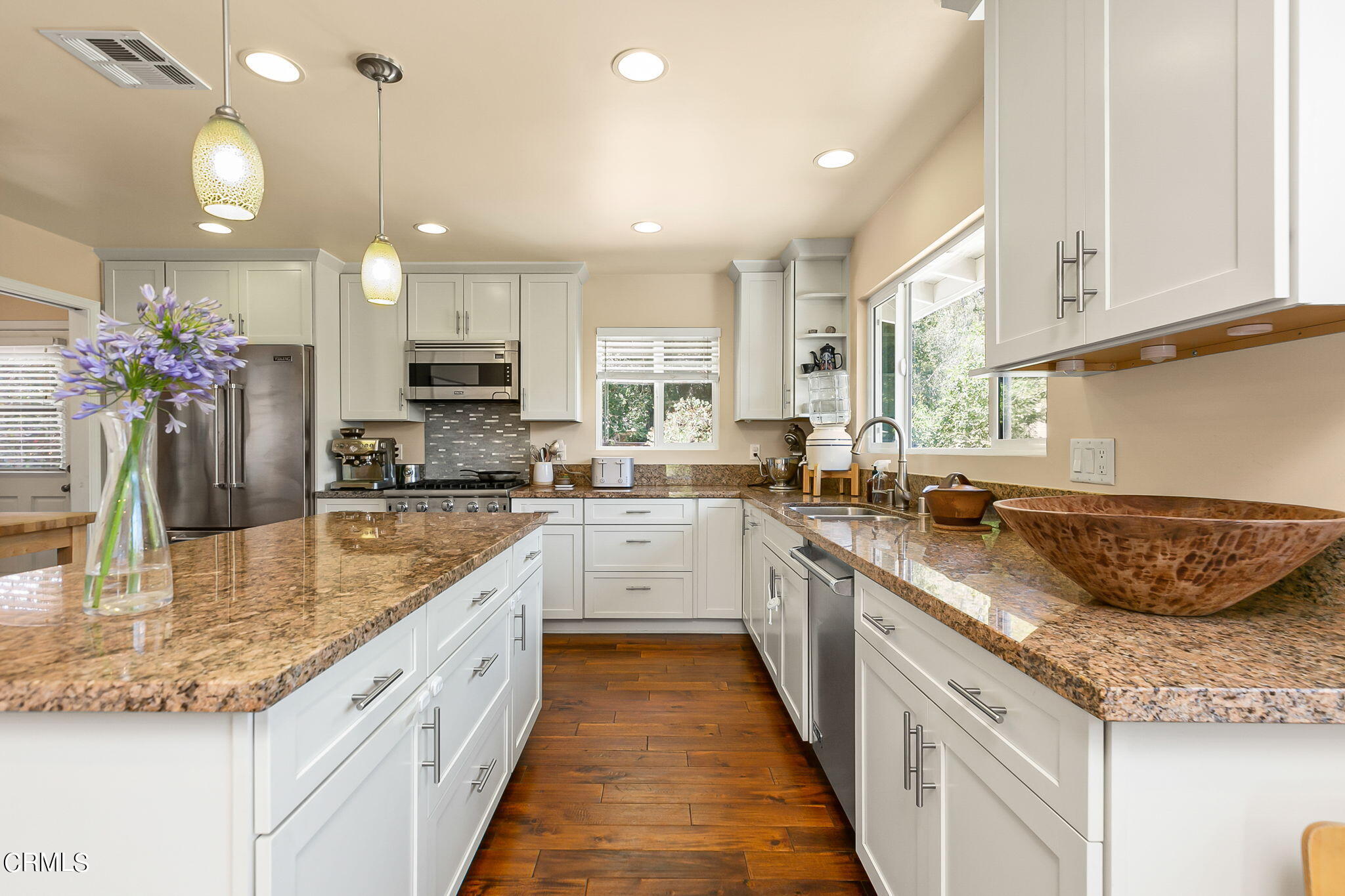 807 Daly Road Ojai, CA 93023 - Photo 20 of 50 a large kitchen with kitchen island granite countertop a sink a counter top space appliances and cabinets
