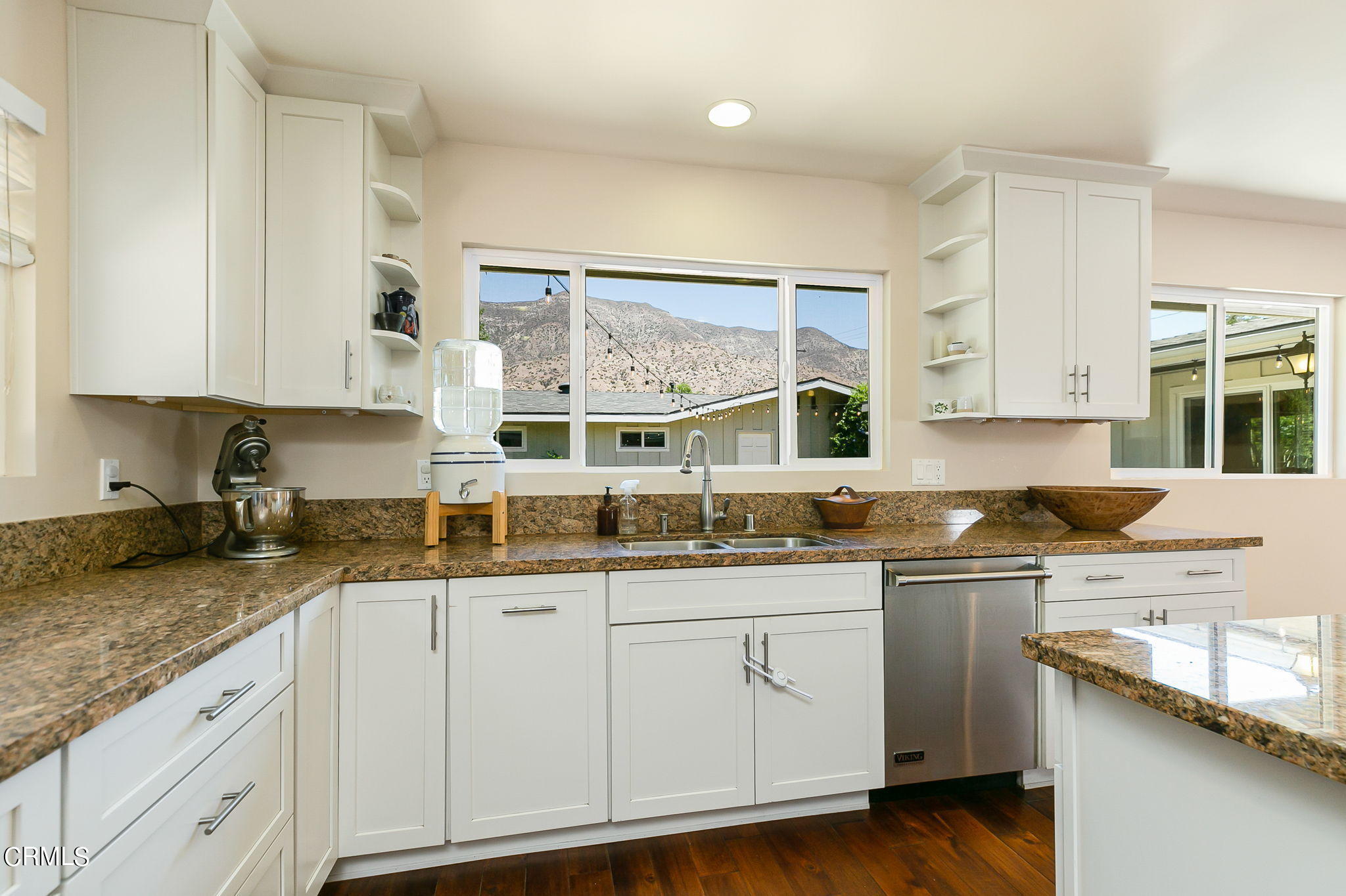 807 Daly Road Ojai, CA 93023 - Photo 21 of 50 a kitchen with granite countertop a sink a stove and cabinets