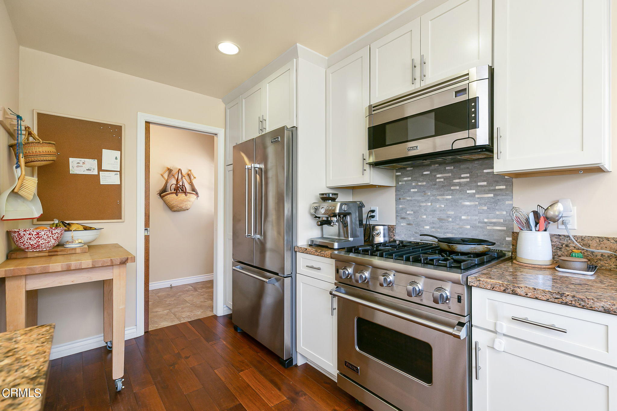 807 Daly Road Ojai, CA 93023 - Photo 22 of 50 a kitchen with stainless steel appliances granite countertop a stove microwave and refrigerator