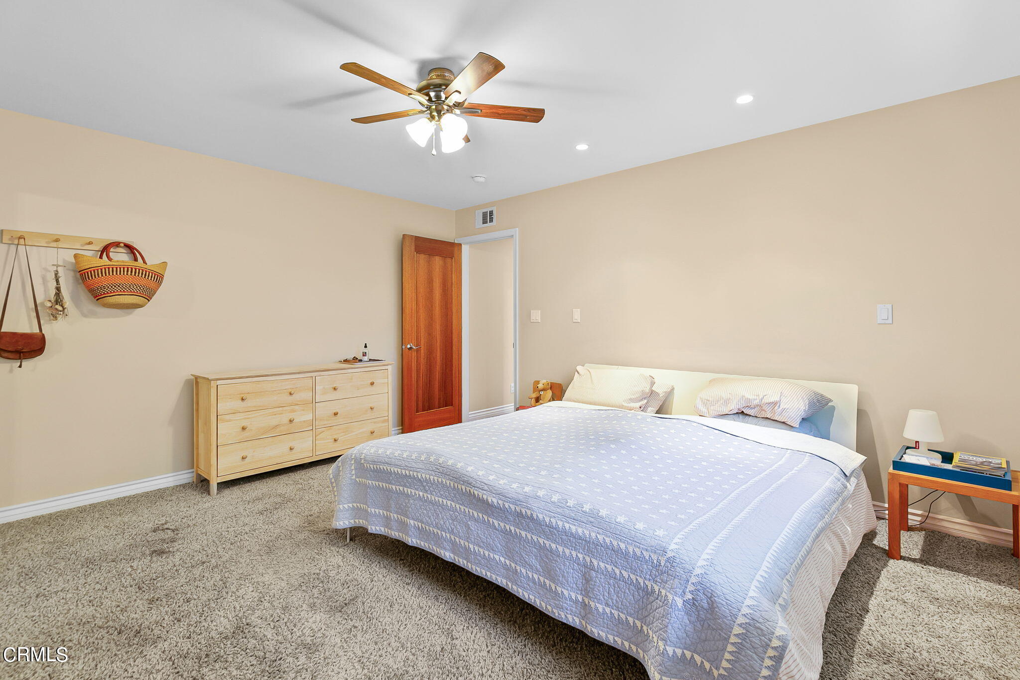 807 Daly Road Ojai, CA 93023 - Photo 24 of 50 a bedroom with a bed and a chandelier