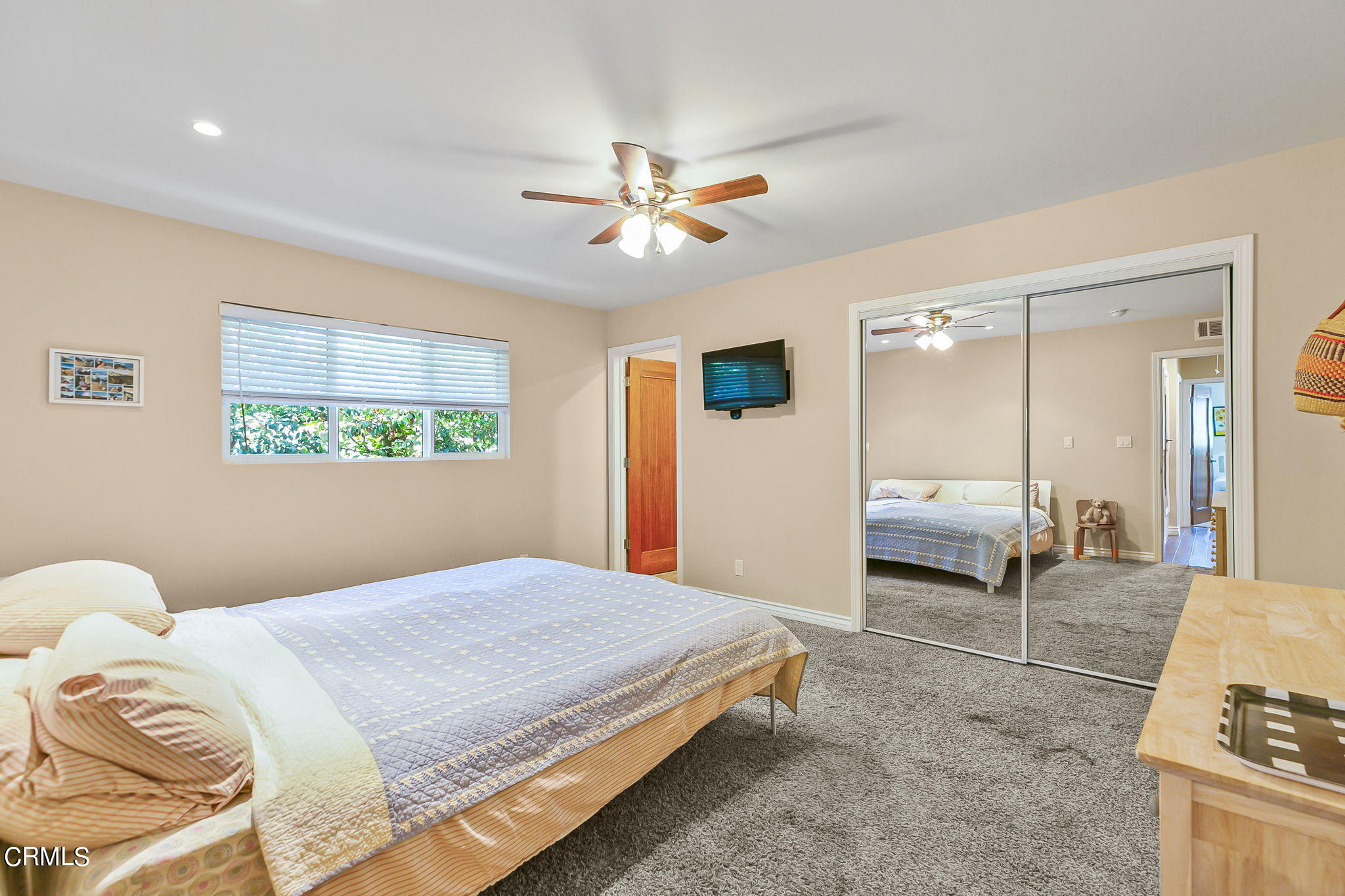 807 Daly Road Ojai, CA 93023 - Photo 25 of 50 a bedroom with a bed and a chandelier