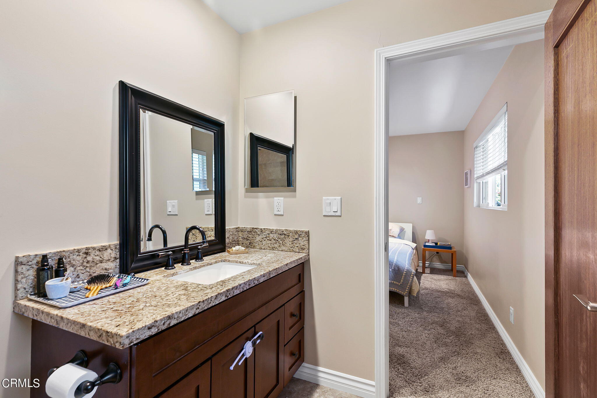 807 Daly Road Ojai, CA 93023 - Photo 26 of 50 a en suite bathroom with a granite countertop sink and a mirror