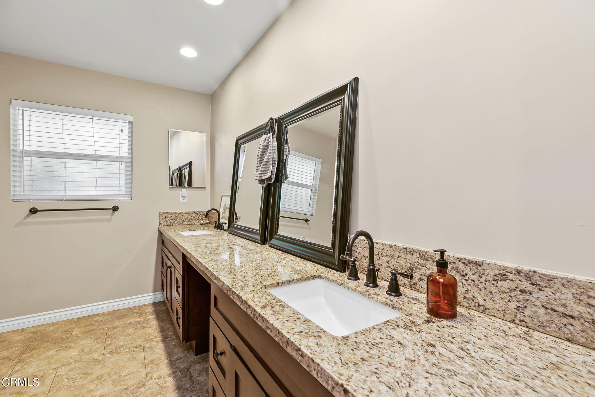 807 Daly Road Ojai, CA 93023 - Photo 29 of 50 a bathroom with a granite countertop sink and a mirror