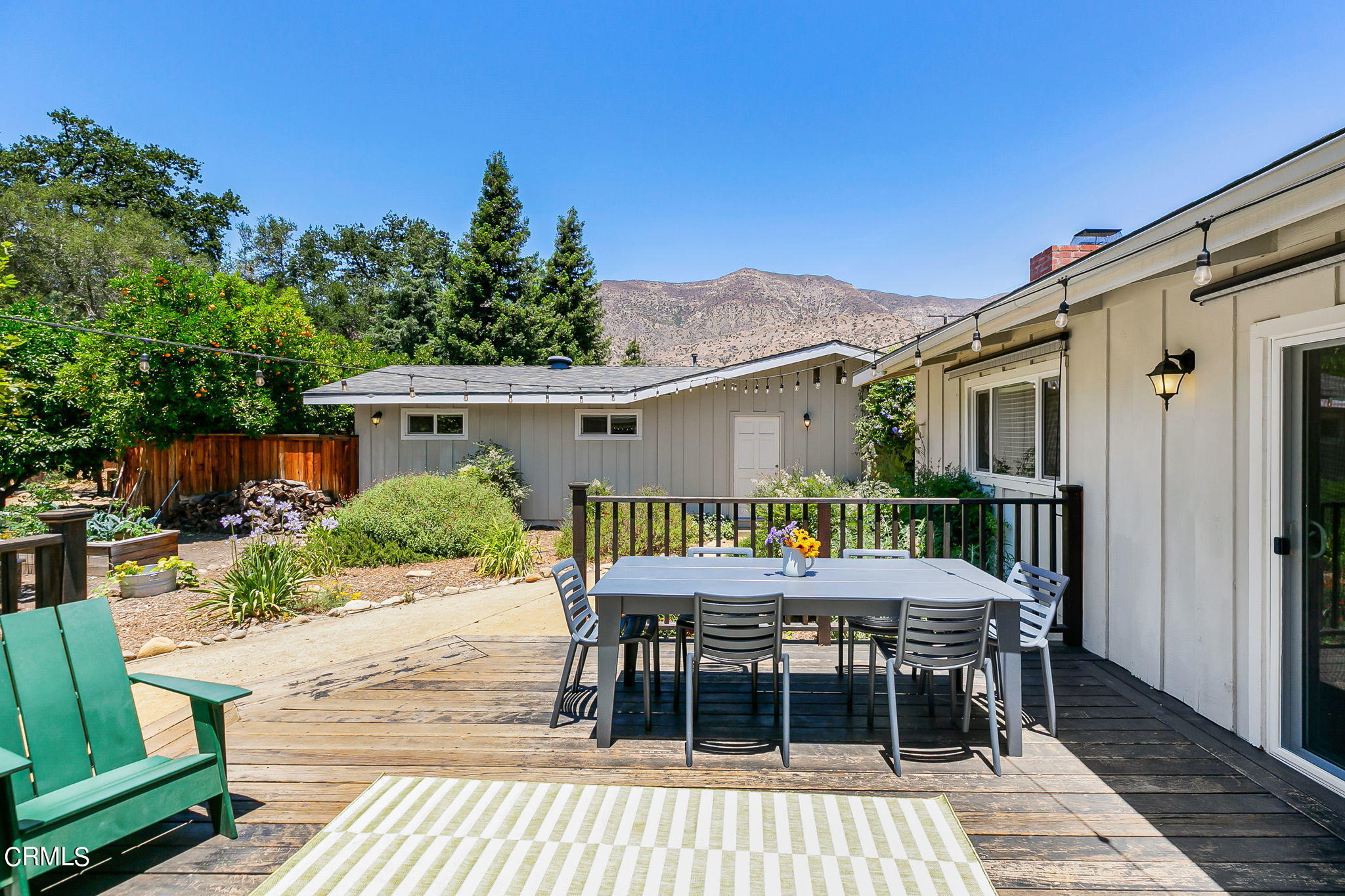 807 Daly Road Ojai, CA 93023 - Photo 32 of 50 a patio with wooden table and chairs