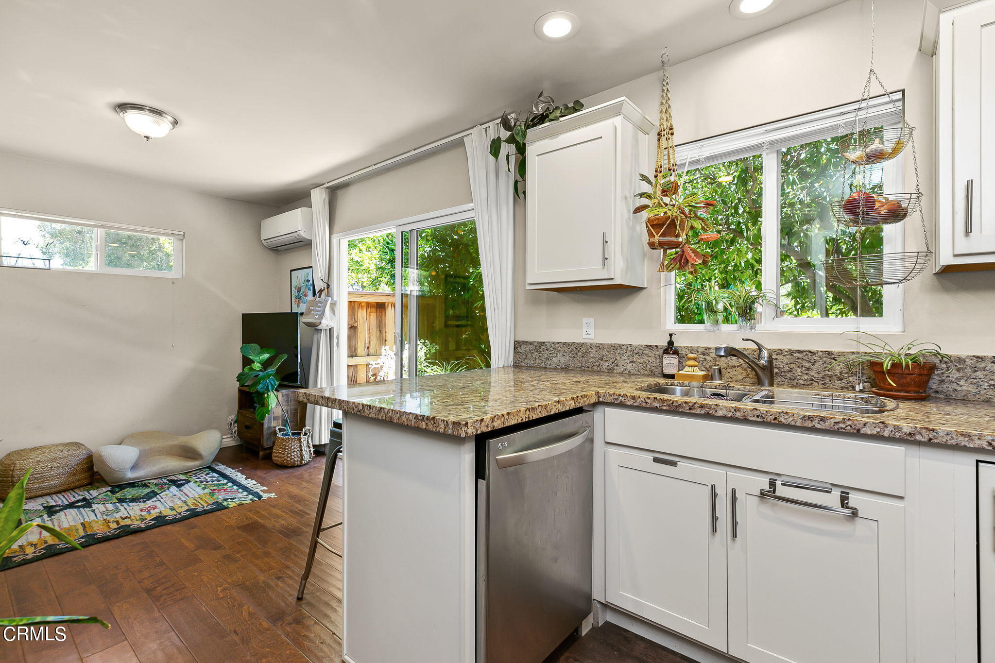 807 Daly Road Ojai, CA 93023 - Photo 47 of 50 a kitchen with a granite countertop sink window and cabinets