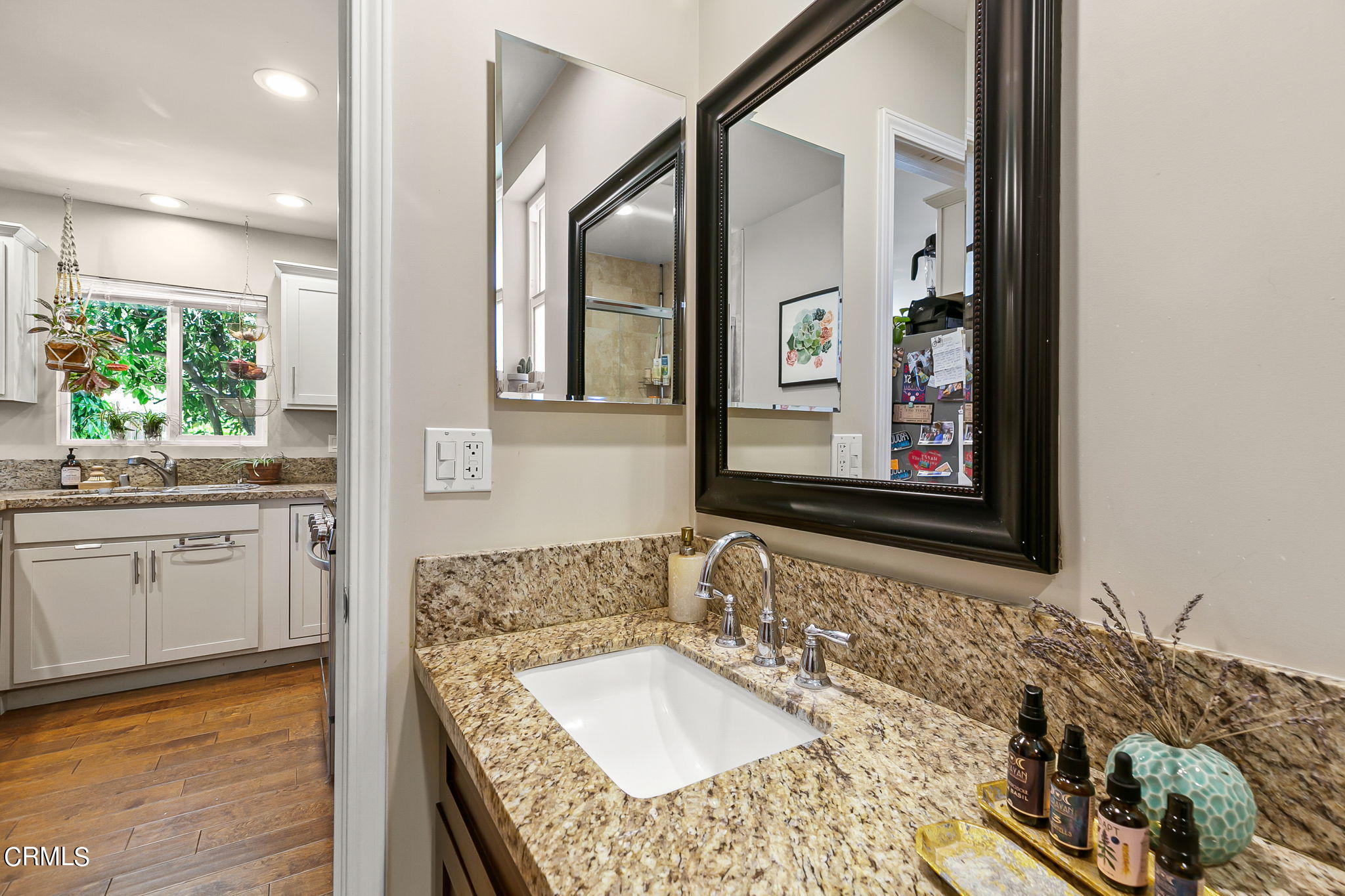 807 Daly Road Ojai, CA 93023 - Photo 48 of 50 a bathroom with a granite countertop tub sink and mirror
