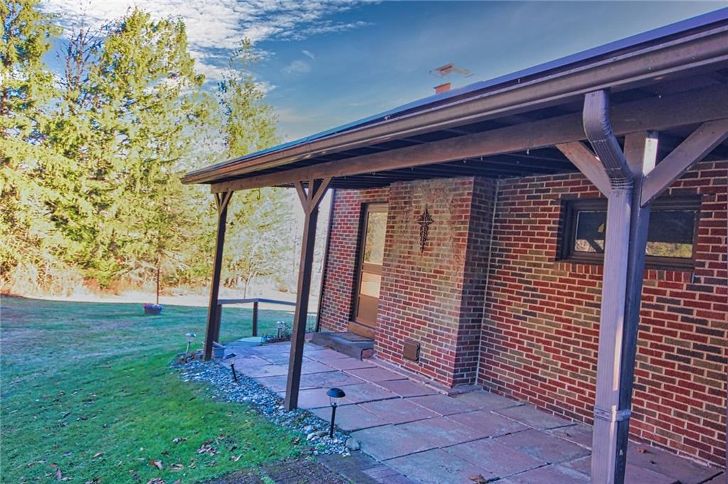 389 Story Road Export, PA 15632 - Photo 7 of 31 Back covered patio, accessed from family room