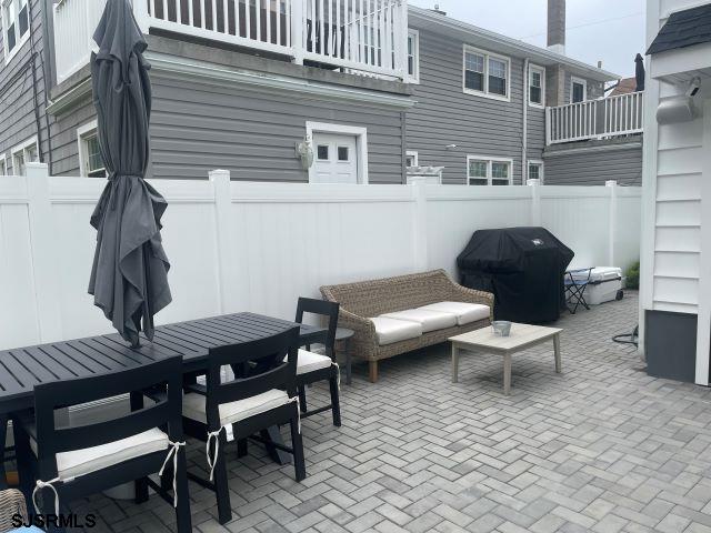 103 North Monroe Avenue, Unit ALSO AVAILABLE STARTING MAY 15 Margate City, NJ 08402 - Photo 16 of 33 a outdoor space with a couch and chairs