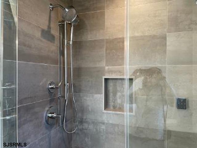 103 North Monroe Avenue, Unit ALSO AVAILABLE STARTING MAY 15 Margate City, NJ 08402 - Photo 19 of 33 a bathroom with a shower