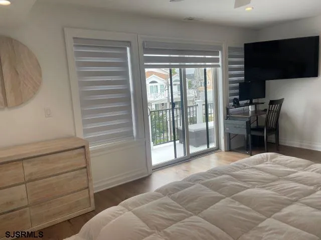 a view of a bedroom with cabinet and a flat screen tv