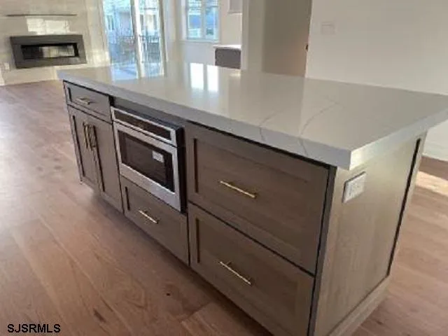 a kitchen with stainless steel appliances a stove and a refrigerator