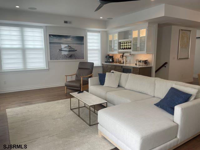 103 North Monroe Avenue, Unit ALSO AVAILABLE STARTING MAY 15 Margate City, NJ 08402 - Photo 9 of 33 a living room with furniture and windows