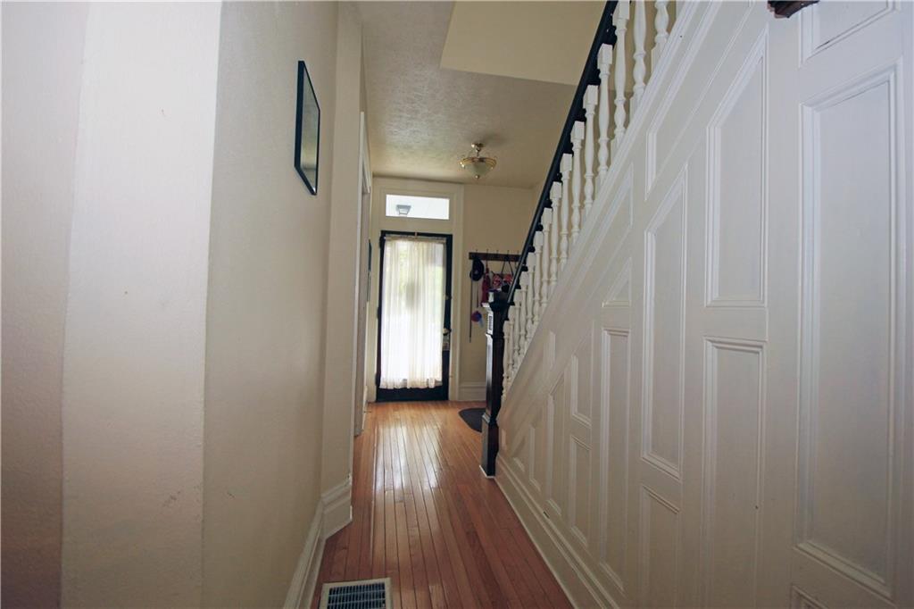 915 Malvern Road Pittsburgh, PA 15202 - Photo 11 of 23 The main entry hall invites you into this Victorian house loaded with character. The entry has beautiful oak hardwood floors with judges paneling on the stairwell and beautiful wood banisters with custom spindles. There is a spacious area just inside the door that welcomes guests into the house.